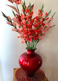 Artificial Floral Arrangement in Red Vase