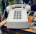 Vintage Grey Hotel Phone with a Red indicator light on top.  Push button dial