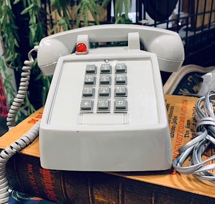 Vintage Grey Hotel Phone with a Red indicator light on top.  Push button dial