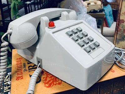 Vintage Grey Hotel Phone with a Red indicator light on top.  Push button dial